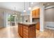 Kitchen with granite countertops, hardwood floors, stainless appliances and access to the outdoor patio at 1076 Rosemary St, Denver, CO 80230