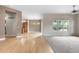 Open-concept layout featuring hardwood floors and large windows that provide natural light at 1076 Rosemary St, Denver, CO 80230