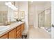 Beautiful bathroom features a double vanity, a large walk-in shower, and a separate soaking tub at 1076 Rosemary St, Denver, CO 80230