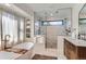 This luxurious bathroom offers a soaking tub, glass-enclosed shower, and tiled walls at 6709 Walker Ct, Niwot, CO 80503