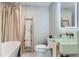 This bathroom offers a soaking tub, a unique sink and mirror, and colorful tile accents at 6709 Walker Ct, Niwot, CO 80503