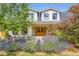View of the front entrance featuring a walkway lined with lavenders and a home with white sidings at 6709 Walker Ct, Niwot, CO 80503