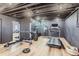 Finished basement gym features workout machines and mirrored wall with wood-look laminate flooring at 6709 Walker Ct, Niwot, CO 80503