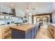 Spacious kitchen featuring a large island with seating, modern appliances, and open layout at 6709 Walker Ct, Niwot, CO 80503