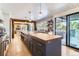 Modern kitchen featuring a large center island, stainless steel appliances, and plenty of counter space at 6709 Walker Ct, Niwot, CO 80503