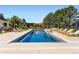 An in-ground pool has a waterfall feature and is surrounded by patio furniture and landscaping at 6709 Walker Ct, Niwot, CO 80503