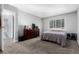 Spacious bedroom with carpet, a dresser, and plenty of natural light at 10211 Ura Ln # 8-102, Thornton, CO 80260