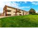 Exterior view of the complex with well maintained lawns and balconies at 10211 Ura Ln # 8-102, Thornton, CO 80260
