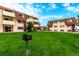 The complex buildings are set among well maintained grounds with mature trees and outdoor grill at 10211 Ura Ln # 8-102, Thornton, CO 80260