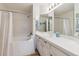 Clean bathroom with a bathtub and updated vanity at 5885 W Atlantic Pl, Lakewood, CO 80227