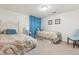 Basement bedroom with twin beds and light blue decor at 5885 W Atlantic Pl, Lakewood, CO 80227