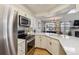 Modern kitchen with stainless steel appliances and white cabinetry at 5885 W Atlantic Pl, Lakewood, CO 80227