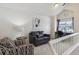 Inviting living area with vaulted ceilings, a cozy seating arrangement, and a well-lit workspace at 5885 W Atlantic Pl, Lakewood, CO 80227