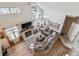 High-ceilinged living room with a fireplace and large windows at 5885 W Atlantic Pl, Lakewood, CO 80227