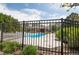 View of community pool and clubhouse through the fencing at 5885 W Atlantic Pl, Lakewood, CO 80227