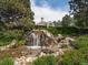 Scenic waterfall feature near community building offers tranquil views and a natural ambiance at 5885 W Atlantic Pl, Lakewood, CO 80227