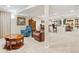 Finished basement with seating area, wet bar, and decorative furnishings at 12421 W Fair Dr, Littleton, CO 80127