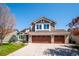 Charming two-story home with a three-car garage and beautiful landscaping at 12421 W Fair Dr, Littleton, CO 80127