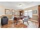 Comfortable home office with hardwood floors, ample natural light, and built-in bookshelves at 12421 W Fair Dr, Littleton, CO 80127