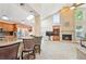 Well-lit living room connects to the kitchen with a stone fireplace at 12421 W Fair Dr, Littleton, CO 80127
