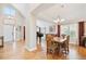 Open-concept with hardwood floors connecting the entry to dining area at 12421 W Fair Dr, Littleton, CO 80127
