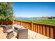 Breathtaking lake view from this patio with stone pavers and seating at 12421 W Fair Dr, Littleton, CO 80127