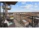 Relaxing condo balcony with wrought iron railings, furniture, grill, and expansive views of the city at 2990 E 17Th Ave # 1004, Denver, CO 80206