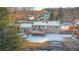 Aerial view of house, deck, and snowy yard at 11177 W 68Th Pl, Arvada, CO 80004