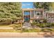 Two-story home with a charming front porch and nicely landscaped front yard at 11177 W 68Th Pl, Arvada, CO 80004