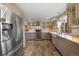 Modern kitchen featuring stainless steel appliances and ample cabinetry at 11177 W 68Th Pl, Arvada, CO 80004