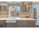 Updated kitchen featuring white farmhouse sink and gray cabinets at 11177 W 68Th Pl, Arvada, CO 80004