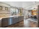 Modern gray kitchen with stainless steel appliances and a farmhouse sink at 11177 W 68Th Pl, Arvada, CO 80004