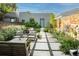 Serene backyard with paved seating and lush garden at 3168 W 29Th Ave, Denver, CO 80211