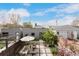 Aerial view of a contemporary backyard with a patio, pergola, lush landscaping, and modern architecture at 3168 W 29Th Ave, Denver, CO 80211