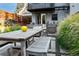 Inviting backyard with outdoor dining area and well-manicured landscaping at 3168 W 29Th Ave, Denver, CO 80211