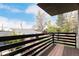 Exterior balcony with dark railings offering views of the lush trees and neighborhood at 3168 W 29Th Ave, Denver, CO 80211