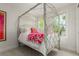 Comfortable bedroom showcasing a unique bedframe, bright windows, and stylish decor at 3168 W 29Th Ave, Denver, CO 80211