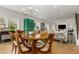 Dining area with hardwood floors connects to the living area and features an elegant green accent piece at 3168 W 29Th Ave, Denver, CO 80211