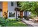 Inviting two-story home with a wood door, xeriscape landscaping, and elegant front entry at 3168 W 29Th Ave, Denver, CO 80211