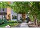 Contemporary two-story home featuring a wood door, xeriscape yard, and modern design at 3168 W 29Th Ave, Denver, CO 80211