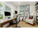 Comfortable home office featuring a large window, desk, and an armchair with vintage posters at 3168 W 29Th Ave, Denver, CO 80211