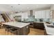 Bright open kitchen with a center island, stainless steel appliances, and hardwood floors at 3168 W 29Th Ave, Denver, CO 80211