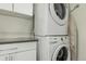 Functional laundry area featuring stacked washer and dryer at 3168 W 29Th Ave, Denver, CO 80211