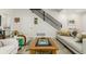 Comfortable living room showcases stylish seating, a modern staircase, and hardwood floors at 3168 W 29Th Ave, Denver, CO 80211