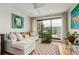Bright living space featuring a white sectional couch, indoor plants, and access to the rooftop patio at 3168 W 29Th Ave, Denver, CO 80211