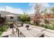 Outdoor patio area with comfortable seating, dining table, and beautiful garden features at 3168 W 29Th Ave, Denver, CO 80211