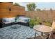 Inviting rooftop patio with sectional seating, area rug, coffee table, and privacy fencing at 3168 W 29Th Ave, Denver, CO 80211