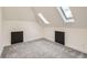Charming attic space with neutral carpet and two skylights offering abundant natural light at 22 Rangeview Dr, Wheat Ridge, CO 80215