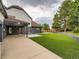 Backyard featuring a lush lawn, patio area, and privacy fence at 22 Rangeview Dr, Wheat Ridge, CO 80215