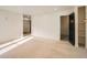 Spacious bedroom with neutral carpet, walk-in closet, and ample natural light at 22 Rangeview Dr, Wheat Ridge, CO 80215